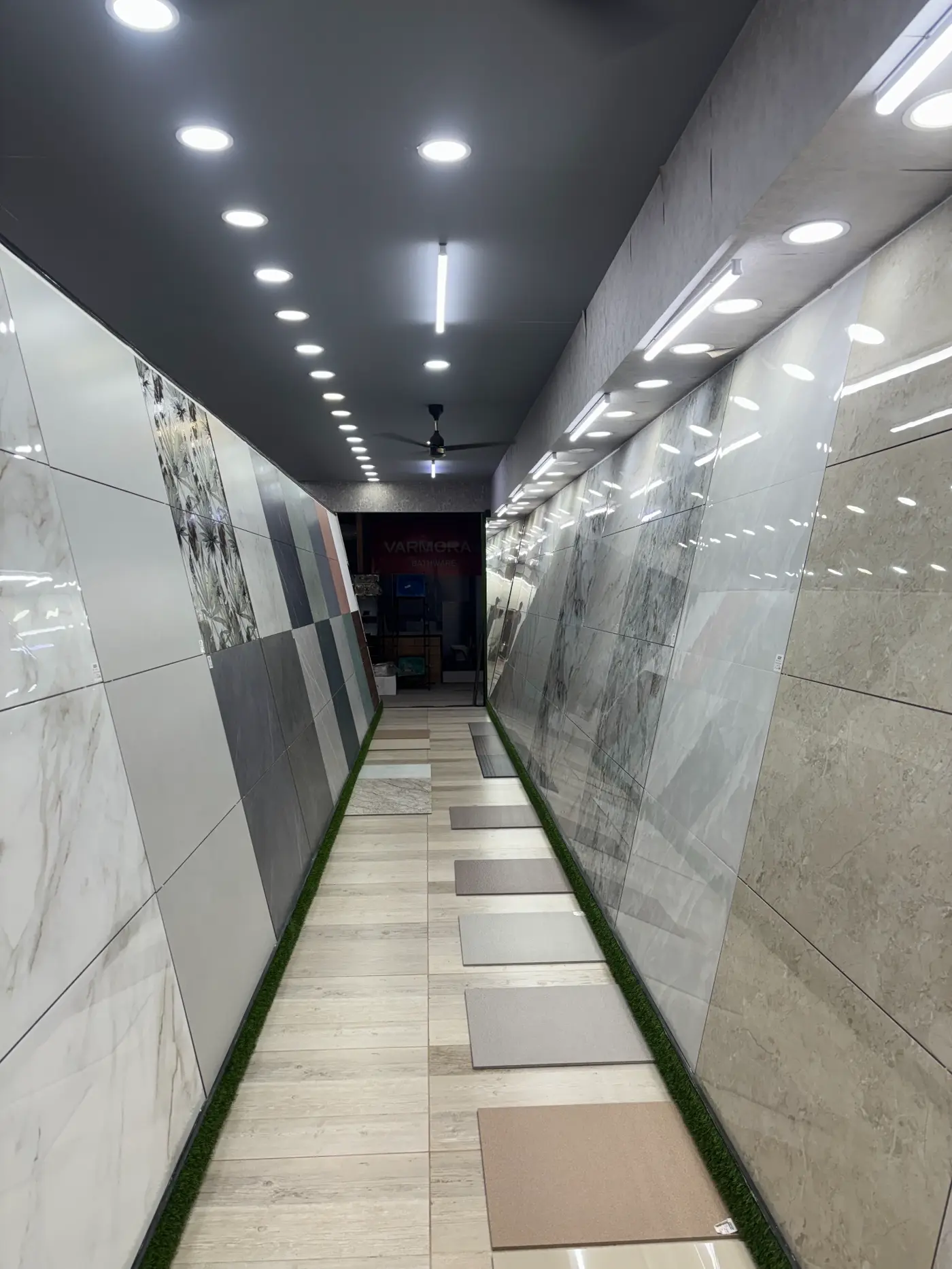 Tile display corridor at CEEYEM Traders showroom in Kuthuparamba